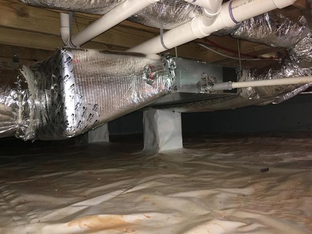 The compact, one-story home is heated and cooled with one ducted high-efficiency mini-split heat pump (18 SEER, 10 HSPF) that is located in the conditioned crawlspace.