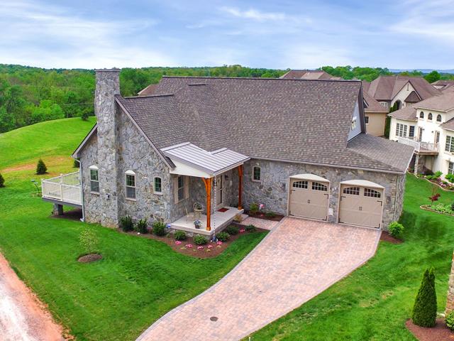 Good site drainage and other moisture management details like kickout flashing and ice-and-water shield combine with the sturdy pre-cast concrete basement and SIP above-grade walls to provide a storm-resistant home.