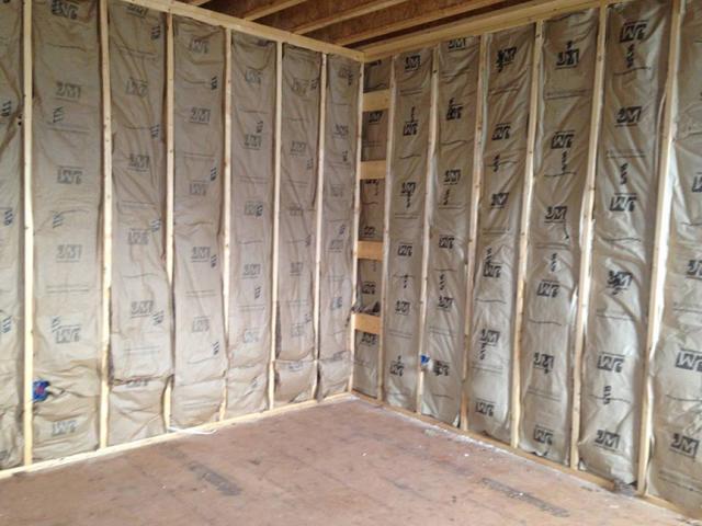 The home's above-grade walls are insulated with 6.5-inch-thick R-23 SIPs while batt insulation fills the rafter bays of the vaulted ceilings.