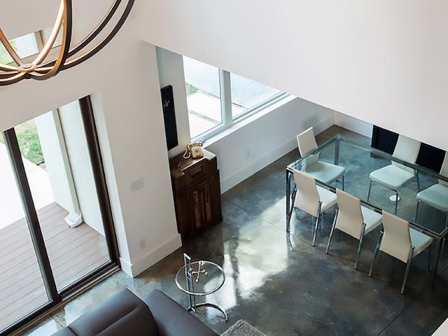 Stained concrete flooring provides moisture-resistant low-maintenance flooring in the home.