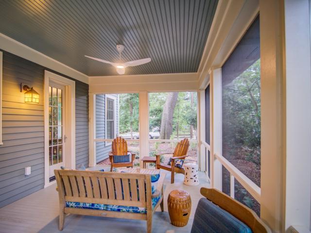 Covered entryways, screened porches, and three-foot overhangs protect windows, walls, and visitors from heavy rains and summer sun.