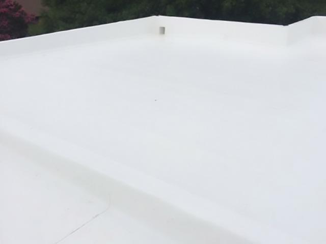 The modern design includes a nearly flat roof covered with a highly reflective 60-mil TPO Cool Roof Certified white roofing membrane that minimizes heat gain.