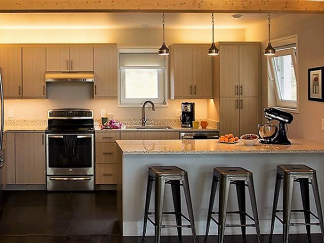 The kitchen is equipped with high-efficiency appliances.