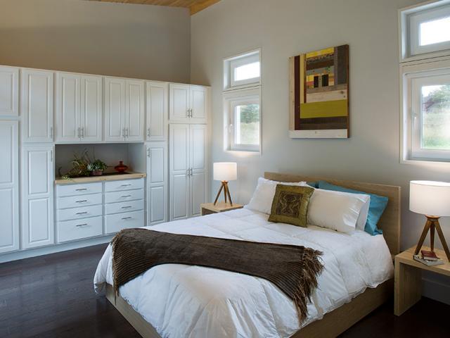 The high-efficiency air-source heat pump (9.5 HSPF, SEER 17.3) has two indoor air handlers: one ductless and one ducted to provide heating and cooling throughout the home.