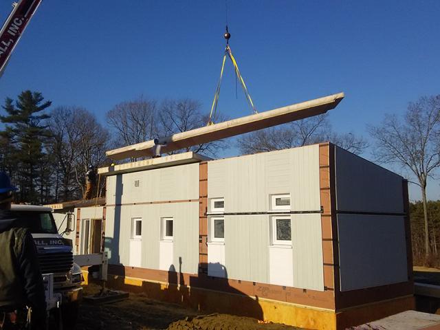 The walls and floors of the home were constructed in a factory and brought to the site for quick assembly.