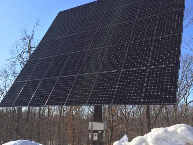 A 13.8-kW array of solar electric panels is mounted on a steel pole near the home. The array is motorized with dual-axis rotation to track the sun, maximizing electrical power generation so it can produce enough electricity to meet all the energy needs of the home plus an electric car.