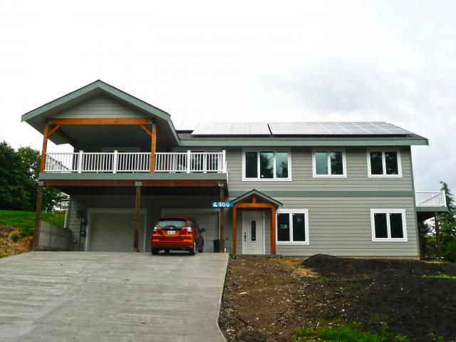Clifton View calls this 2,408-square-foot solar electric home a positive energy home because it produces enough energy from the roof-mounted 9.945-kW PV system to power the home and an electric car. The completed home with PV yields a calculated negative annual utility bill of -$187 per year!