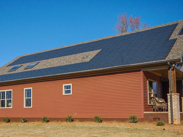 Vinyl siding provides a low-maintenance exterior of this high-performance home, which is expected to cost its homeowners only $11 a month in energy costs, thanks to a high-performance envelope and the solar electric generation system.