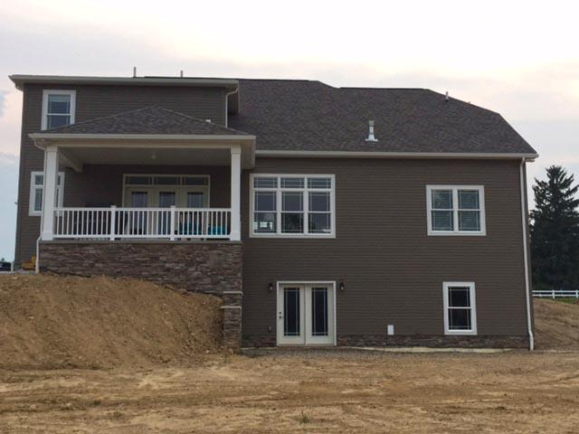 The builder took advantage of the sloping lot with a daylight basement design that permits more living space on a smaller footprint.