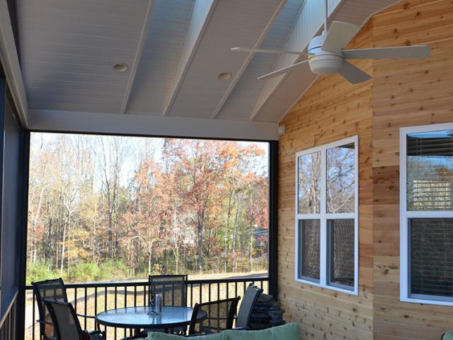 Narrow skylights add natural daylighting to the screened porch while ENERGY STAR ceiling fans provide cooling air flow.