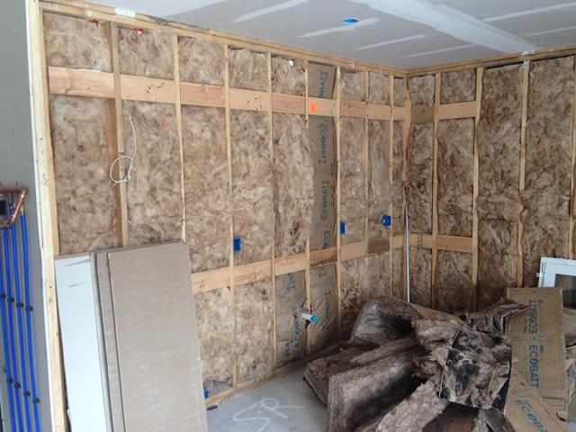 The exterior walls are filled with a mold-resistant glass mineral wool insulation then covered with a coated OSB sheathing plus a fire-rated mineral wool foam board, plus two inches of foil-faced rigid polyisocyanurate.