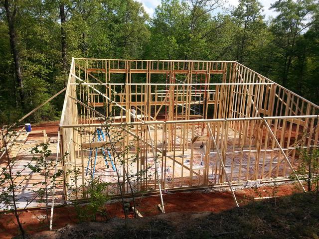 This home uses advanced framing techniques such as California corners, open headers, and single top plates to reduce the amount of lumber used and to leave more space in the walls for insulation.