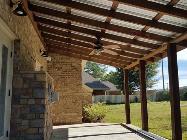 Overhangs and covered porches help to control solar heat gain in this warm-humid climate.