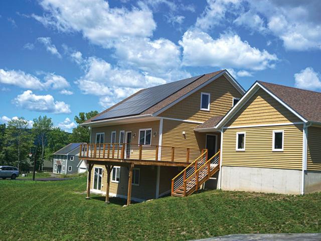 The builder took advantage of the south-facing slope to add a conditioned daylight basement that permits more living space on a smaller footprint.