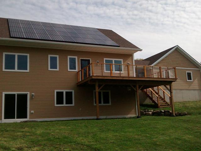 A 9.9-kW photovoltaic electric generation system contributes about $1,600 a year in energy savings.