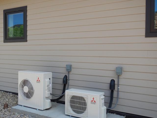 Two high-efficiency (12 HSPF, 26 SEER) ductless mini-split heat pumps heat and cool the home.