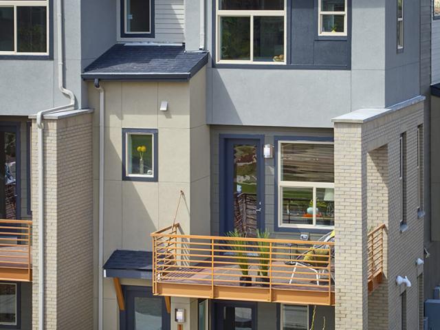 Balconies provide outdoor space and shade entry areas to help cool air for ventilation.