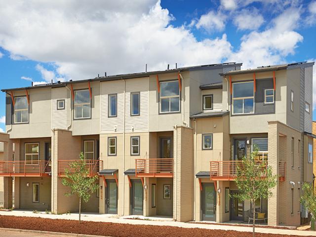 Masonry fins between units provide shading and privacy.