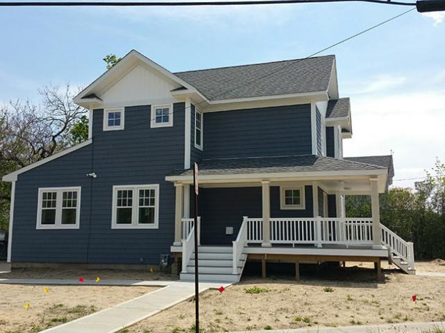 Extra waterproofing details are installed at all windows, and the first floor is slightly elevated to minimize likely impacts from floods.