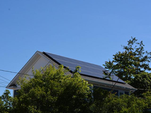 The south-facing roof is equipped with a 6.9-kW solar electric system that helps cut energy costs by nearly $2,600 annually, compared to a similar-sized home built to code.