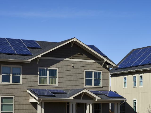 A solar electric system provides more than enough electricity to run the 2,115-square-foot home over the course of the year.