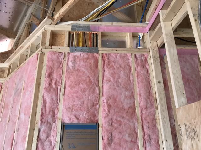 The exterior walls are filled with unfaced fiberglass insulation and sheathed with OSB plus 1&amp;quot; R-5 XPS rigid foam. A strip of foam fabric is attached to the top and bottom plates to serve as an air-tight gasket between framing and drywall.