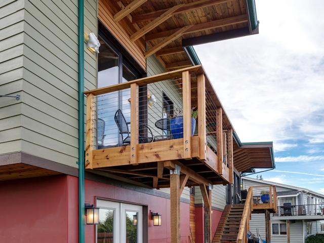 Deep overhangs and porches protect the walls and windows from high overhead summer sun as well as rain and snow.