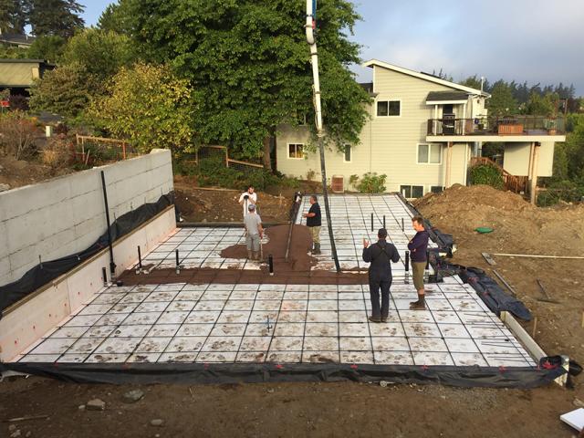 The home's daylight basement slab was poured on 4 inches of EPS rigid foam, while the walls were wrapped in 1.5 inches of EPS. Below-grade walls were also protected with a polyethylene membrane adhered to the walls and a dimpled plastic rain mat over the rigid foam.