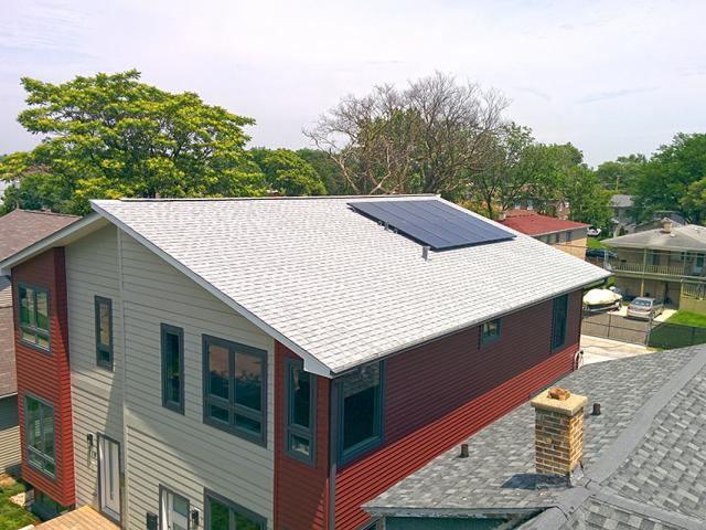 The simple gable roof is constructed at an unusual 6.55 pitch that allows exactly four and a half sheets of 4-foot-wide coated, taped roof sheathing to be installed as the roof deck with enough space at the peak for a continuous ridge vent. ENERGY STAR reflective shingles cover the roof, which is ideally angled for solar panels.