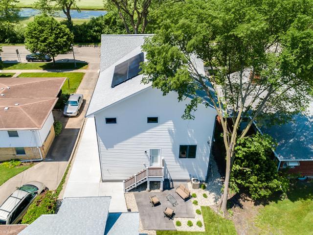 ENERGY STAR-rated reflective shingles cover the roof while minimal roof penetrations leave more space for photovoltaic panels.