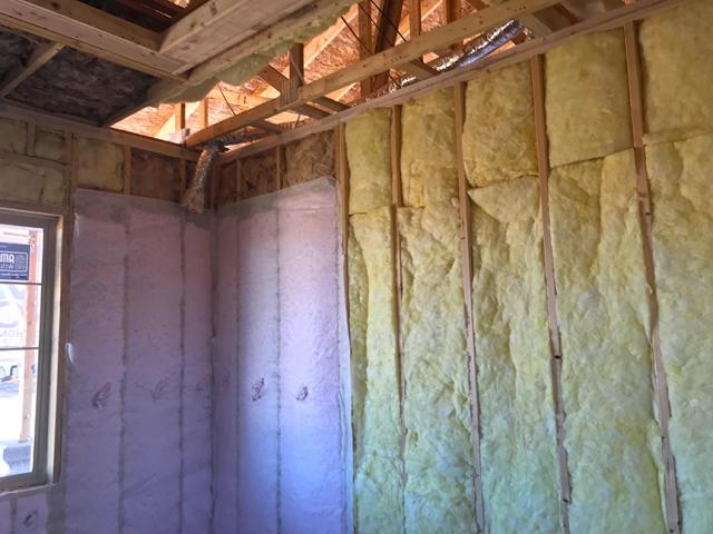 The 2-by-6, 16-inch on-center walls are filled with R-21 of blown fiberglass. Batt insulation is used in some interior wall cavities.