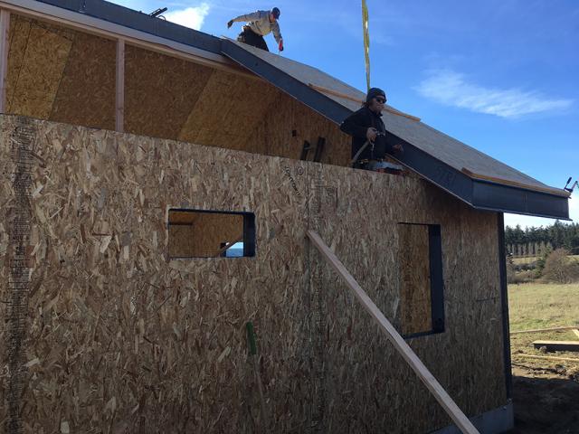 Because all of the structural load is carried by the SIP roof and wall panels, no trusses are needed, allowing the home to have vaulted ceilings and open interiors throughout.