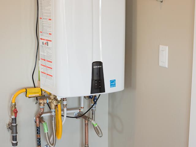 A natural gas 94% efficiency tankless hot water heater provides endless hot water.