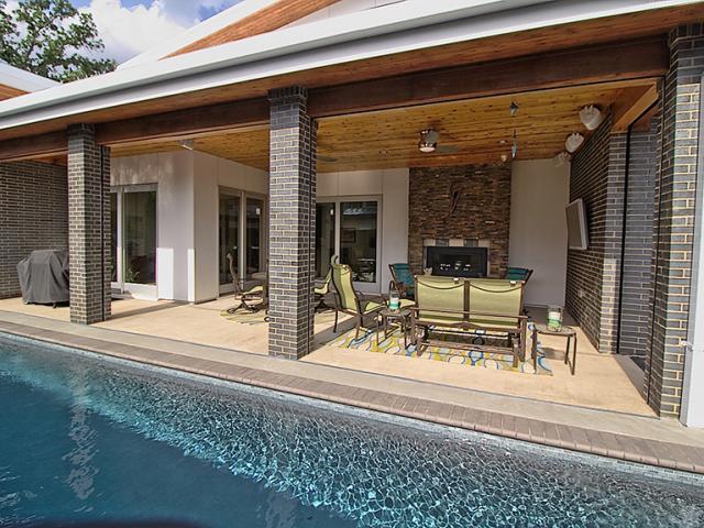 Deep overhangs and covered porches keep out high summer sun and provide naturally cooled living spaces in shoulder seasons.