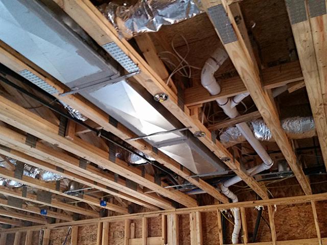 The ducts for the home's high-efficiency gas furnace and air-conditioning systems were located within the home's conditioned space.