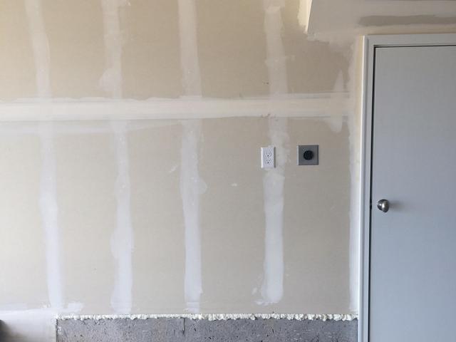 Mudded and taped drywall and canned spray foam help keep garage fumes from leaking into the home