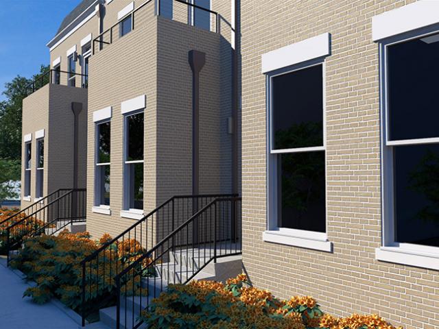 The advanced framed walls of these three-story townhomes are covered with brick veneer on the front that faces the Union Hill historic district, and the remaining sides are fiber cement siding with PVC, wood, and cast trim.