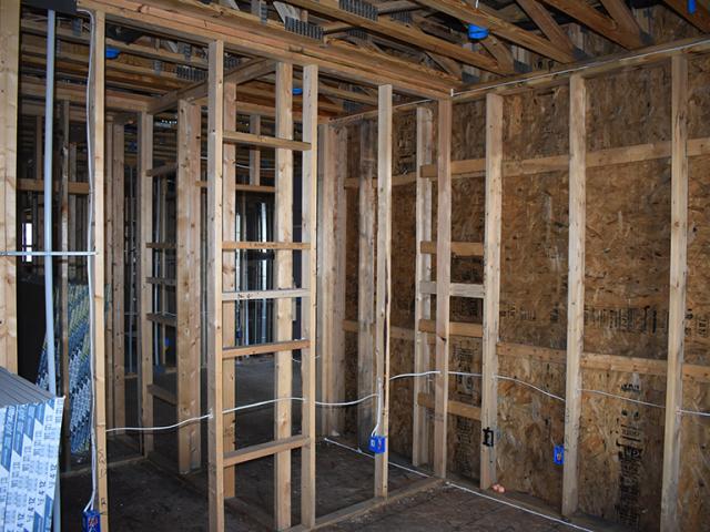 Advanced framing techniques, including 2-by-6 walls spaced at 24 inches on center and ladder blocking at wall intersections, allow more space for insulation in the wall cavities while open-web floor joists provide space between floors for ducting.