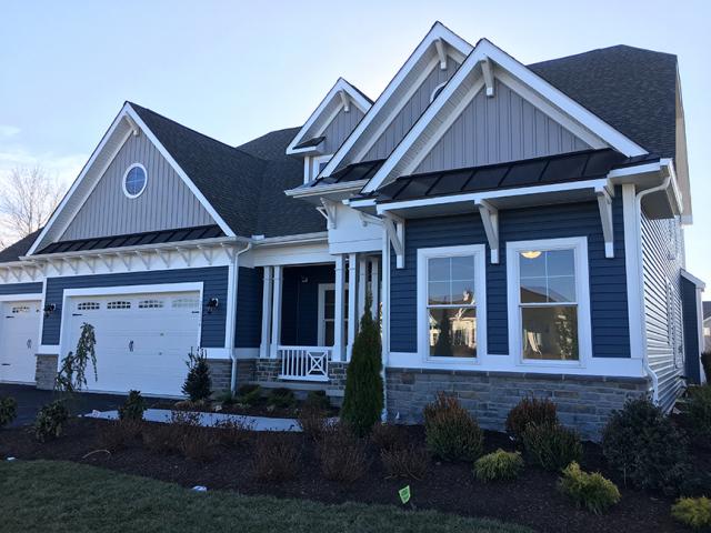 Deep overhangs and porches help protect the windows and vinyl siding from sun and rain.