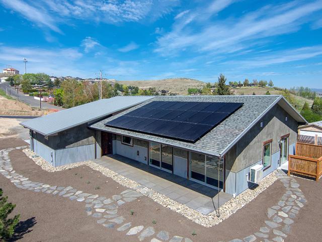 With 7 kW of photovoltaic solar panels on the roof, the high-performance home scores a -12 on the HERS Index, with anticipated $0 annual utility bills and enough surplus power to operate one or two electric cars. Even without PV, the home would score a very efficient 36 on the HERS Index.