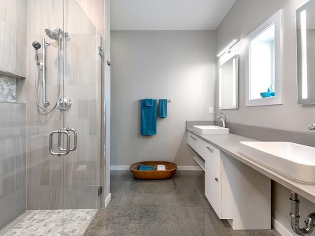 The builder installed a heat pump water heater in a central location less than 20 feet from all faucets. Together with low-flow fixtures and a xeriscaped yard, these measures are expected to reduce water usage to less than 30% of the usage of typical homes in the region.
