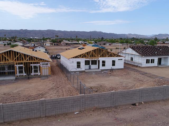 The value-engineered home was constructed of 2-by-6, 24-inch on-center walls that were sheathed with house wrap and R-4 of rigid foam, then wall cavities were filled with R-15 of open-cell spray foam with OSB applied only where needed for structural support.