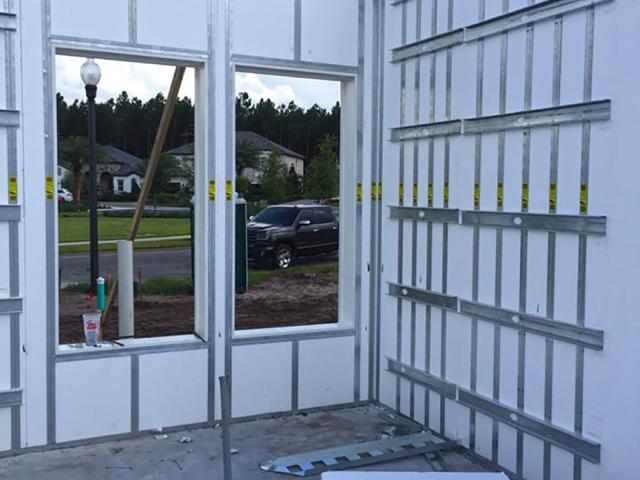 The concrete wall system includes bug-resistant metal framing.