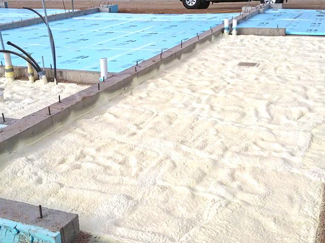 Spray foam and rigid foam were used under the slab while rigid foam wraps the exterior of the foundation walls.