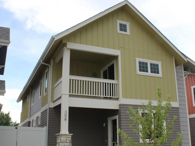 Beneath the fiber cement and stone siding, the exterior walls are filled with blown cellulose.