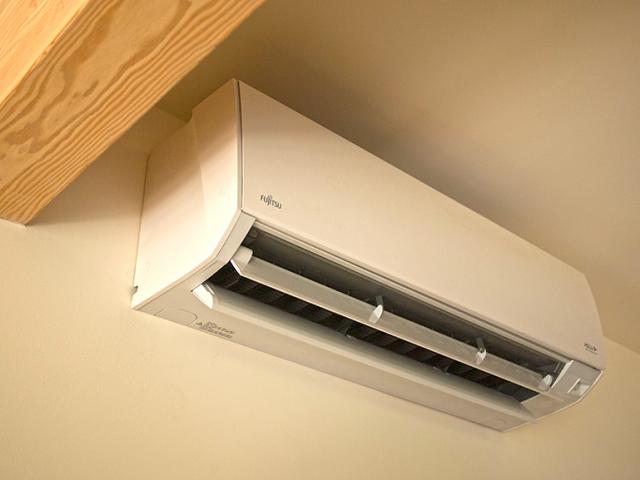 A mini-split heat pump provides highly efficient heating and cooling.