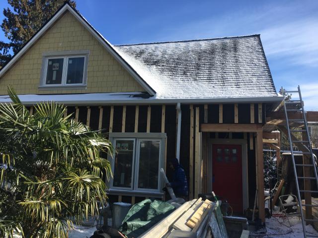 Fiber cement lap siding will attach to the 1-by-4 wood battens, which also provide a ventilating air gap between the siding and the cork insulation.