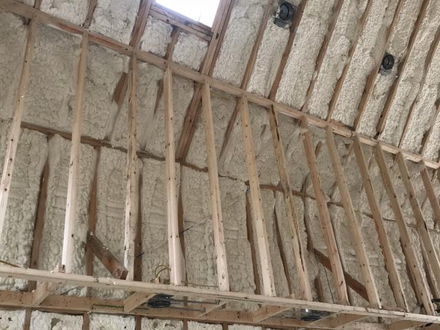 Eight inches of open-cell spray foam fills the rafters on the underside of the roof deck of the unvented vaulted ceilings, providing R-25 of insulation.