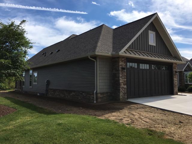 The roof is covered with a synthetic underlayment and ice and water shield in the valleys and eaves, adding durability under the 30-year architectural shingles.