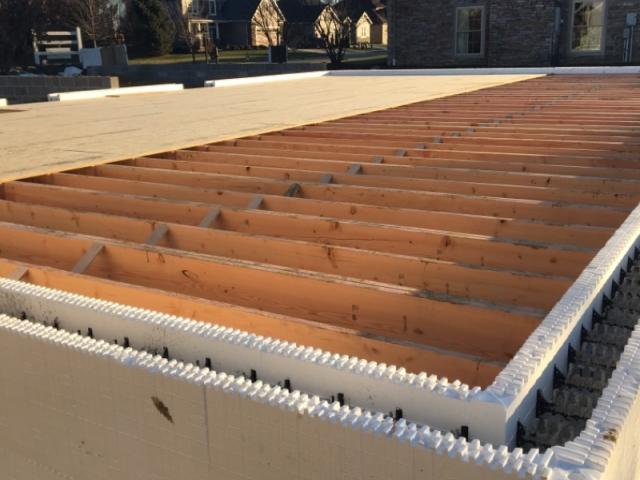 Custom formed concrete footers provide an interior and exterior drainage system around the ICF basement walls to help ensure a dry basement.